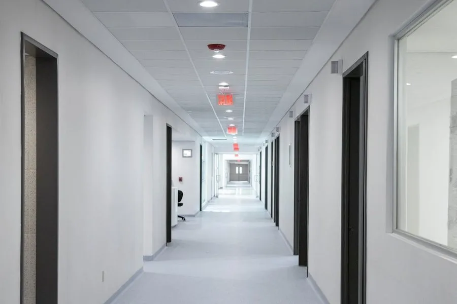 Clean institutional corridor — government facility flooring
